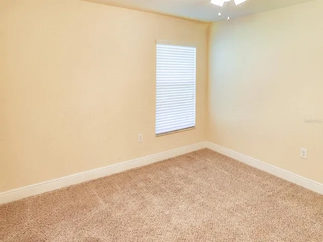a bedroom with a bed and a dresser in it