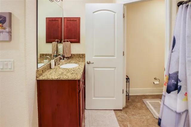 an aerial view of a house with a yard and garden