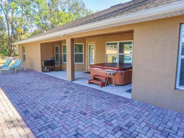 a backyard of a house with yard and seating space