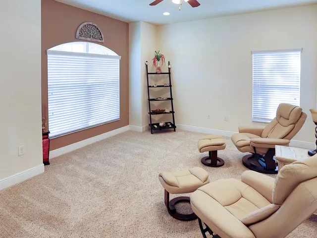 a living room with furniture a window and a couch