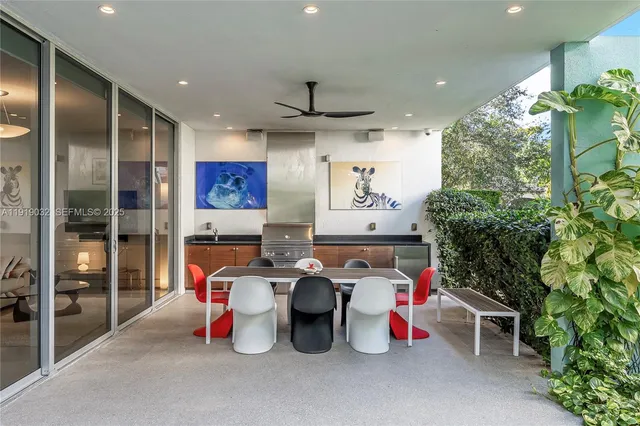 a building outdoor space with patio furniture and potted plants