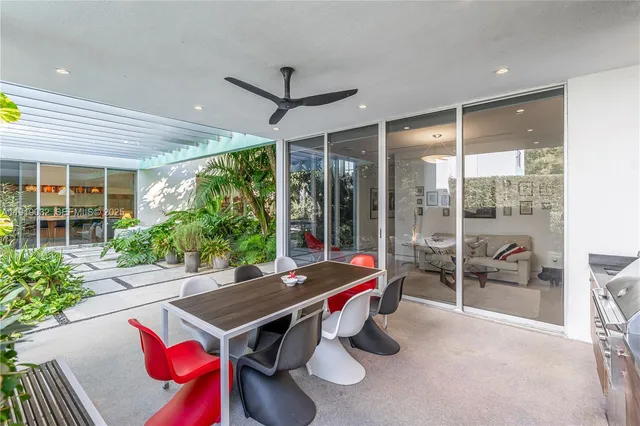 a living room with lots of furniture and a book shelf