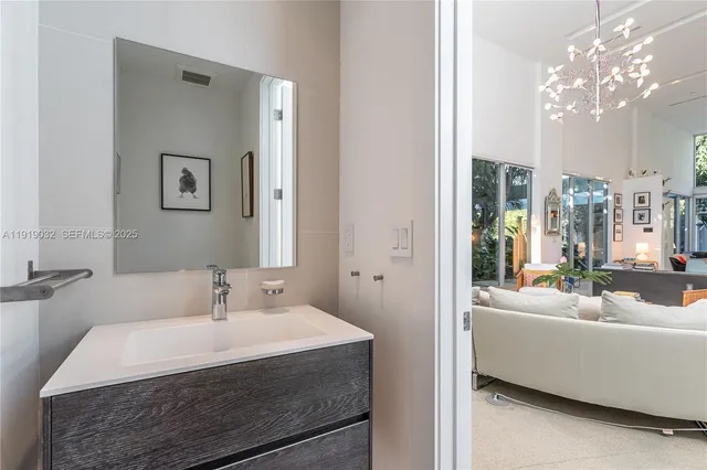 a bedroom with a bed couch and a window