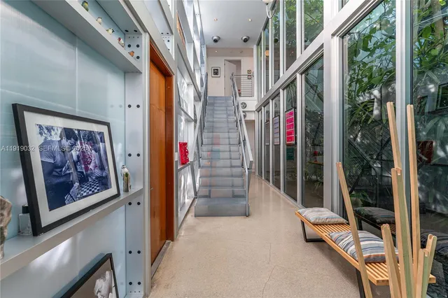 a bedroom with a large bed and a couch