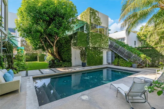 a view of a couches in patio of a yard
