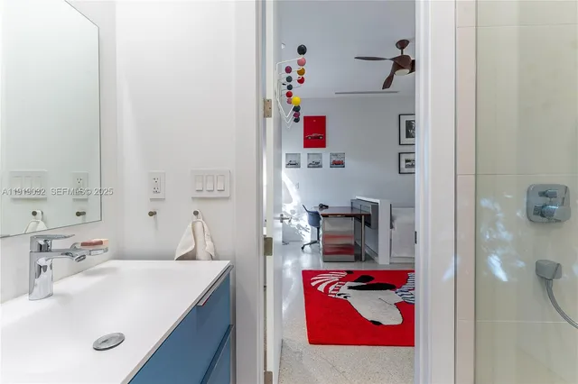 a bedroom with bed and a bookshelf