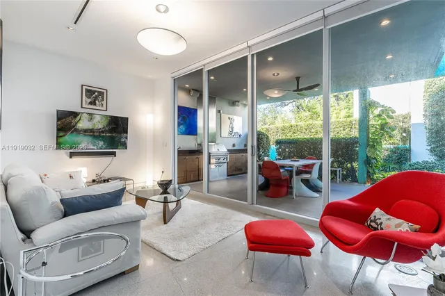a bathroom with a sink mirror vanity and toilet