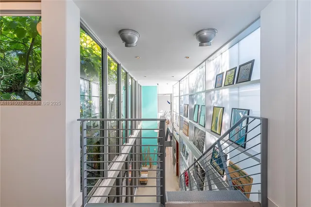 a white room with wooden floor and furniture