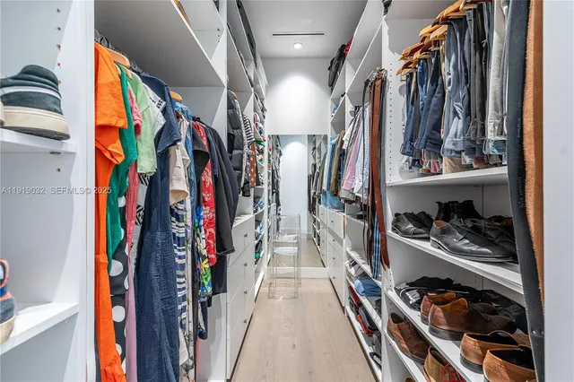 a dining room with furniture a large window and table