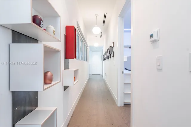 a bedroom with a bed a couch and a window