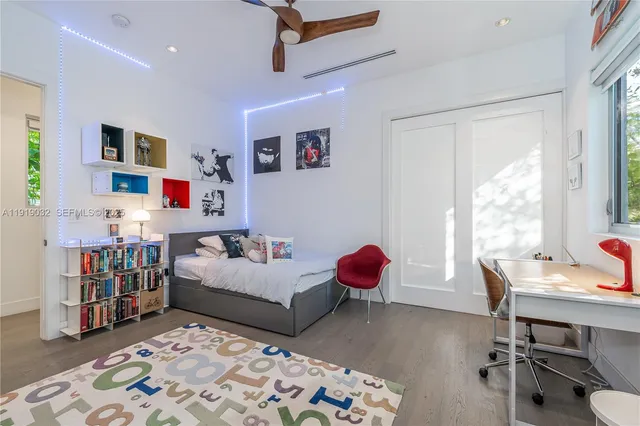 a bathroom with a sink mirror and toilet
