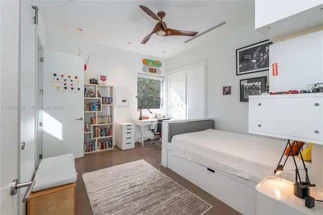 an aerial view of residential building with green space