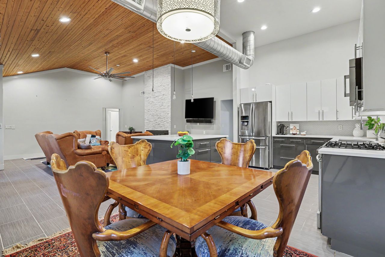 6903 Ardath Street Austin, TX 78757 - Photo 12 of 40 Dining area with a high wood ceiling, recessed lighting, a ceiling fan, and crown molding