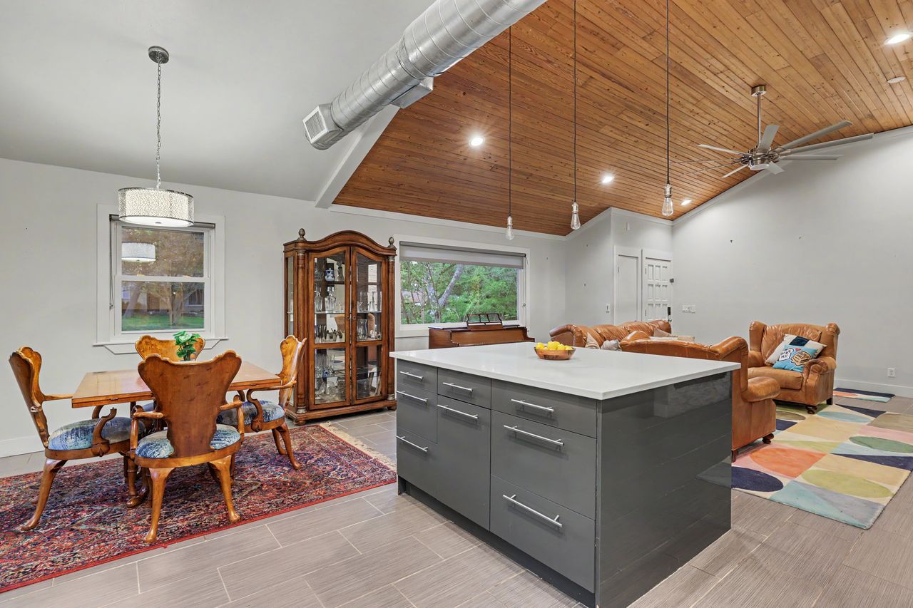 6903 Ardath Street Austin, TX 78757 - Photo 18 of 40 Kitchen featuring a vaulted wooden ceiling, a center island, modern cabinets, ceiling fan, and hanging light fixtures