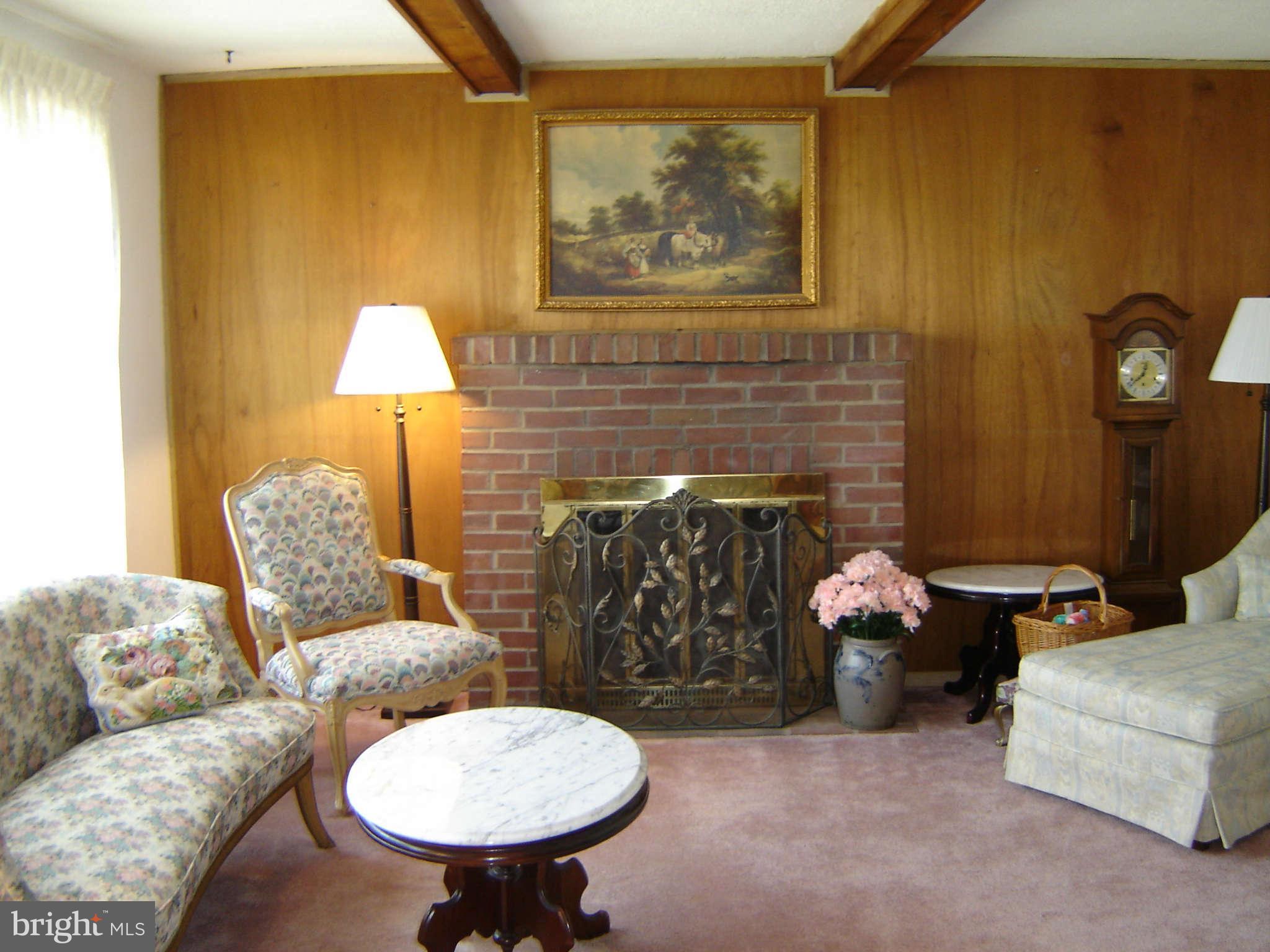 15312 Old Hanover Road Upperco, MD 21155 - Photo 2 of 19 a living room with furniture and a fireplace