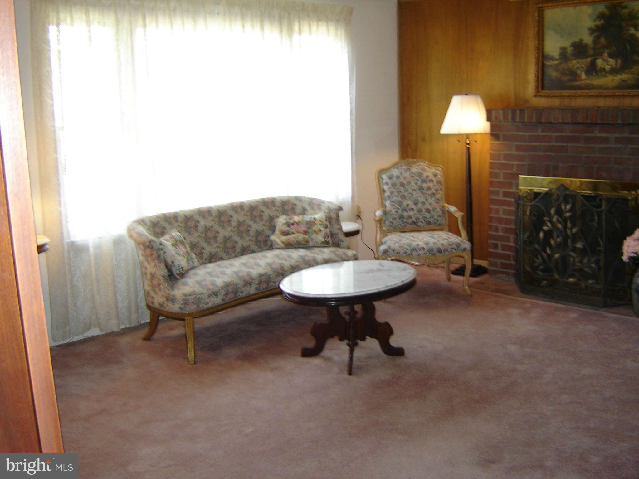 15312 Old Hanover Road Upperco, MD 21155 - Photo 3 of 19 a living room with furniture and a fireplace