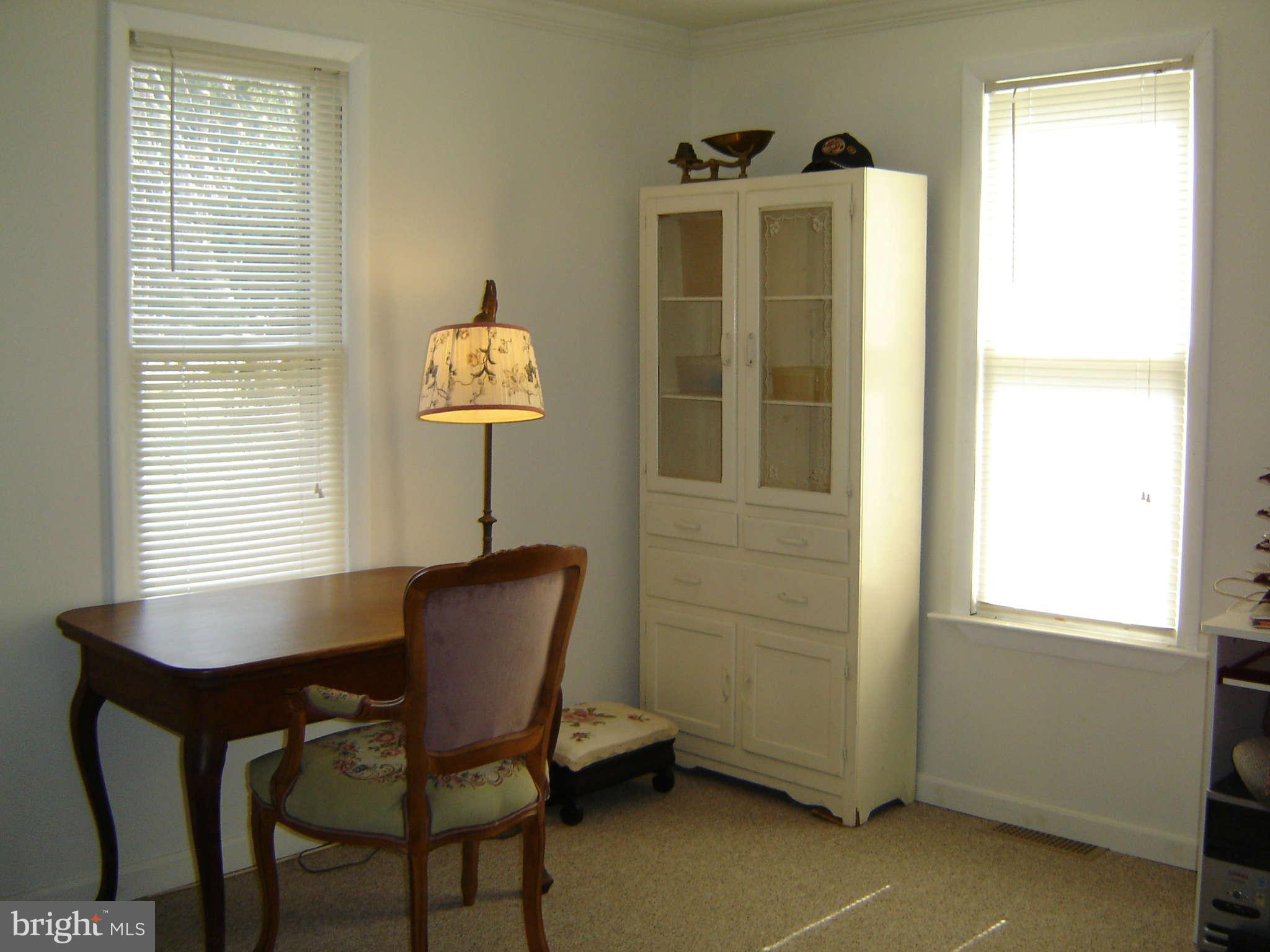 15312 Old Hanover Road Upperco, MD 21155 - Photo 10 of 19 a view of a workspace with furniture and a window