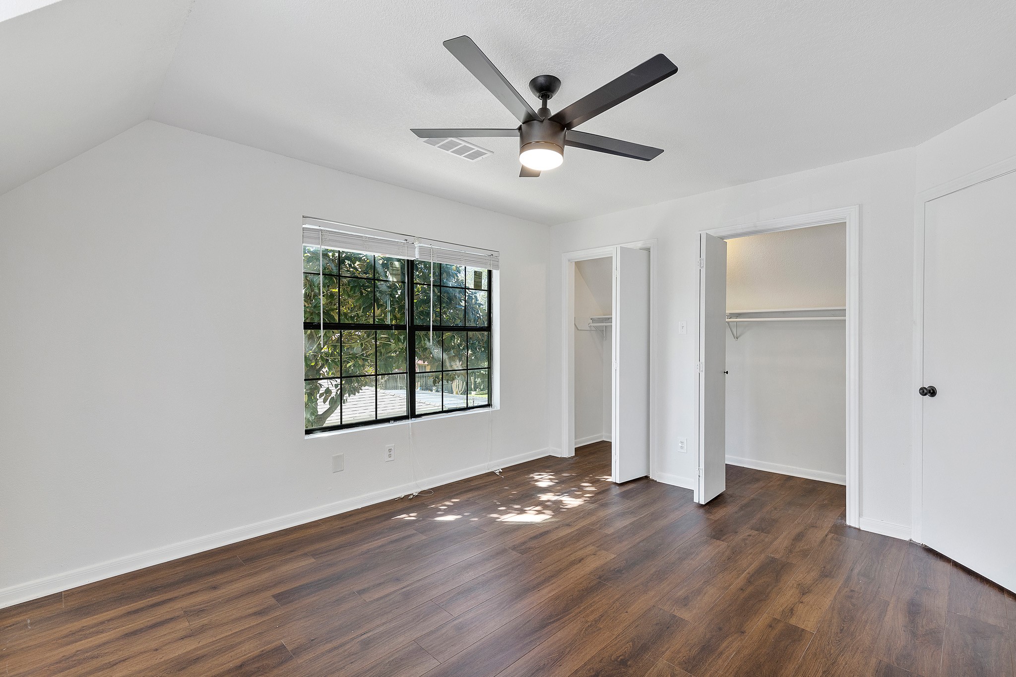 504 Percival Street, Unit A Tomball, TX 77375 - Photo 16 of 26 a view of a big room with wooden floor and windows
