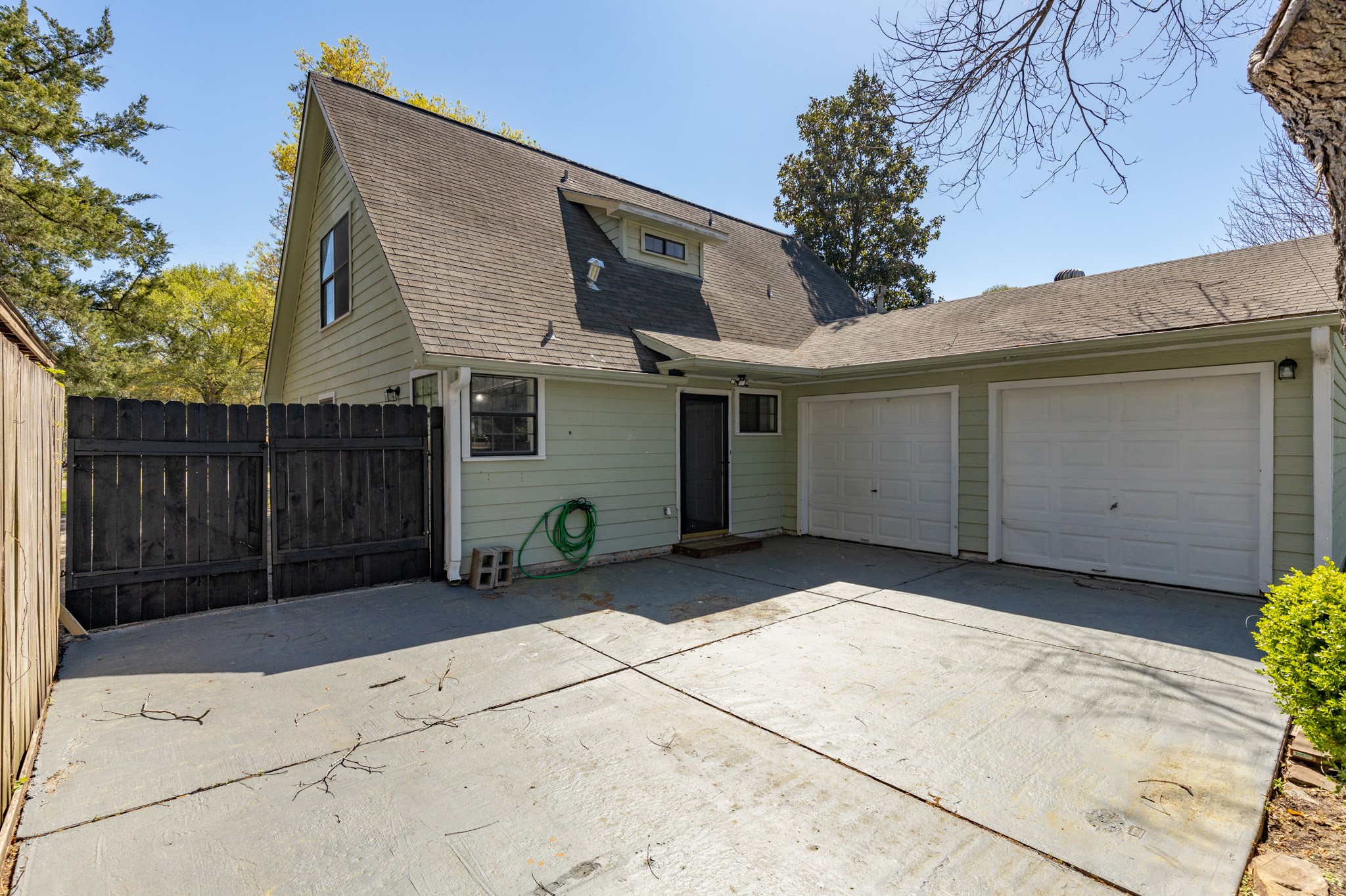 504 Percival Street, Unit A Tomball, TX 77375 - Photo 18 of 26 a view of a house with wooden fence