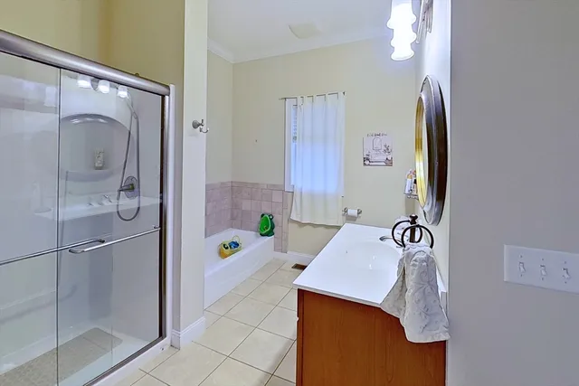 a bathroom with a sink vanity and a mirror