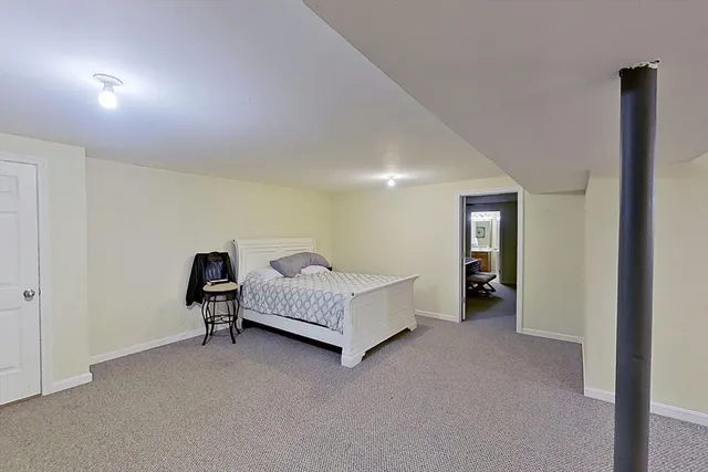 a spacious bedroom with a bed and a table