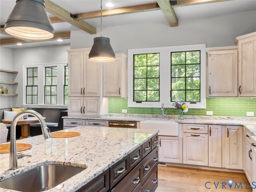 16131 Binley Road Midlothian, VA 23112 - Photo 39 of 99 a kitchen with granite countertop a sink a counter space appliances and cabinets