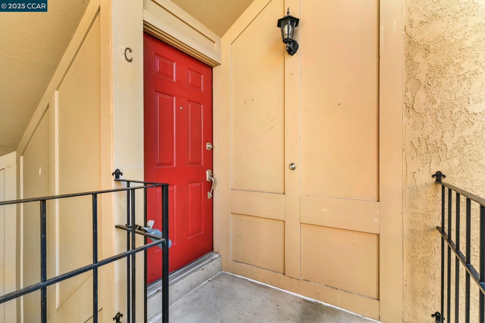 440 Canyon Woods Place, Unit C San Ramon, CA 94582 - Photo 2 of 17 a view of a door with a red door
