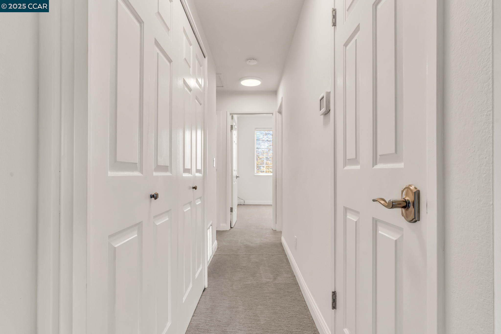 440 Canyon Woods Place, Unit C San Ramon, CA 94582 - Photo 5 of 17 a view of a room with a white door