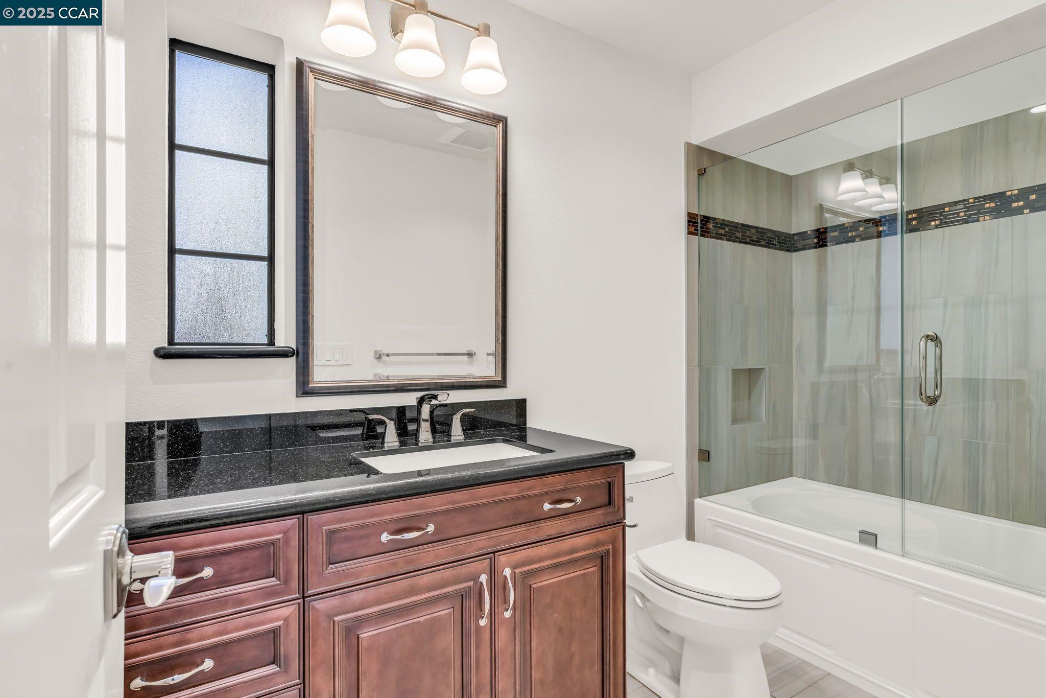 440 Canyon Woods Place, Unit C San Ramon, CA 94582 - Photo 10 of 17 a bathroom with a sink a toilet and shower