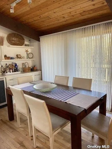 a view of a dining table and chairs in a room