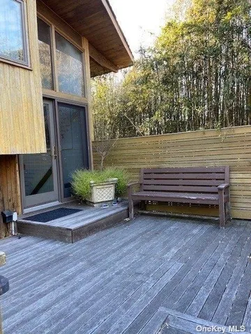 a view of a two chairs in a patio