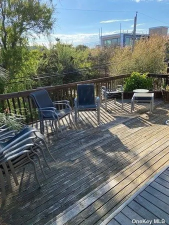 a view of a balcony with furniture