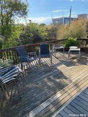 a view of a balcony with furniture
