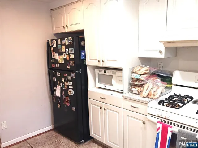 a kitchen with stainless steel appliances a stove and a refrigerator