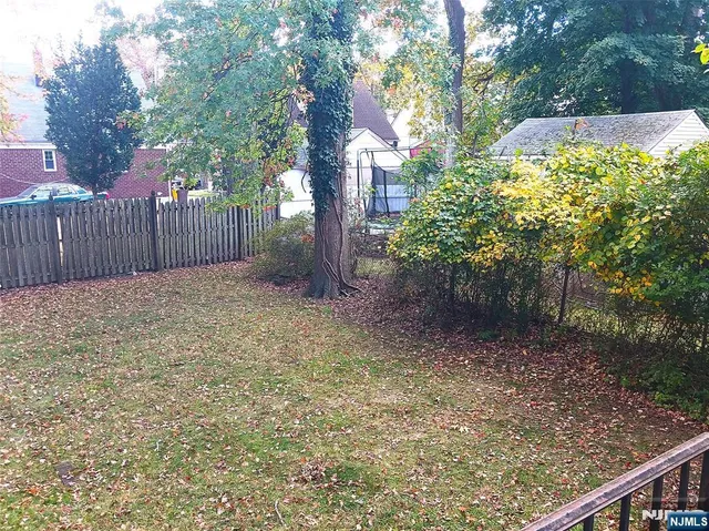 a view of backyard with tree
