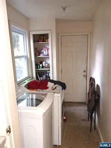 a view of a room with washer and dryer