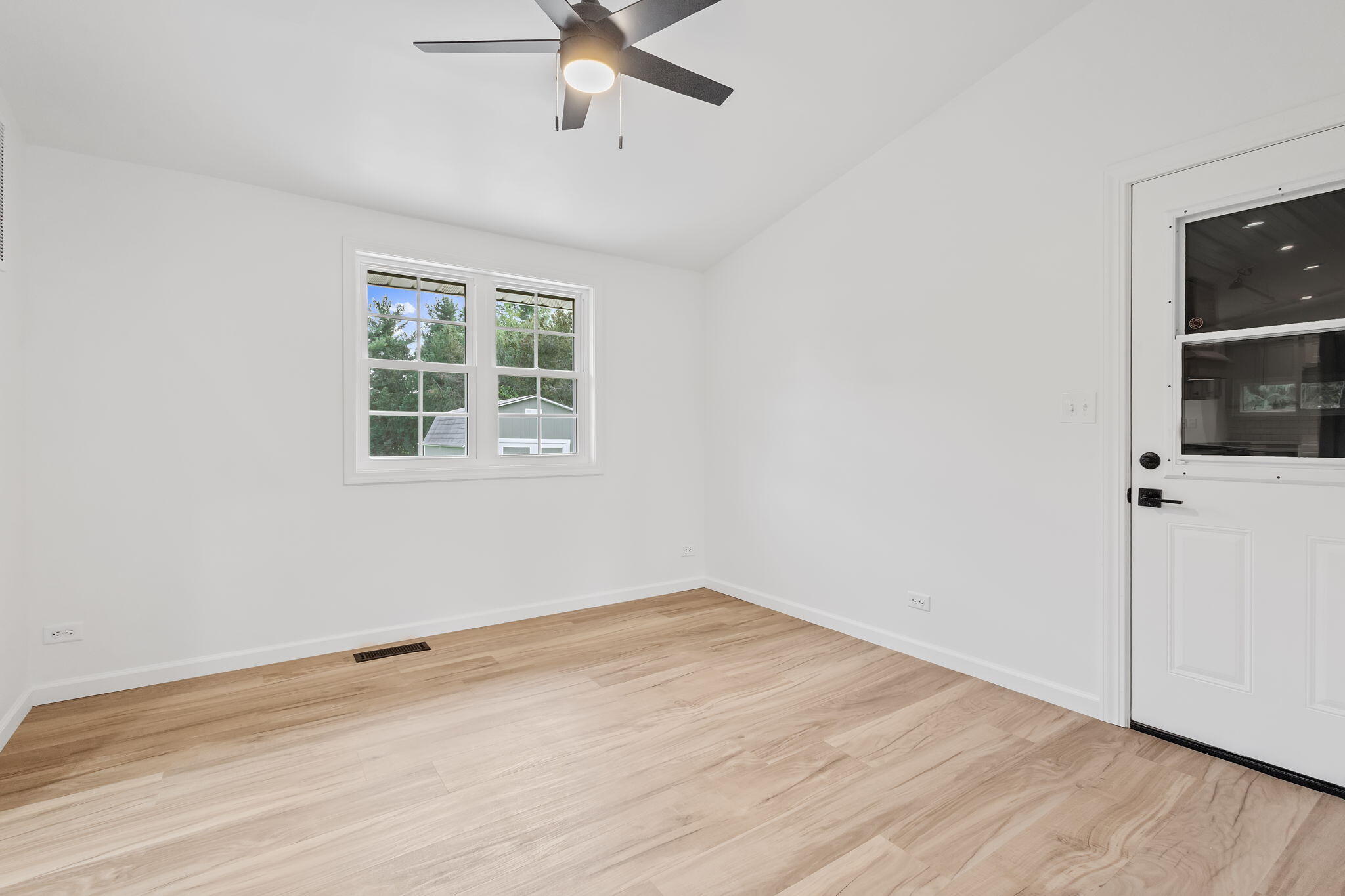 229 West Wood Road Rensselaer, IN 47978 - Photo 11 of 23 an empty room with a window and ceiling fan