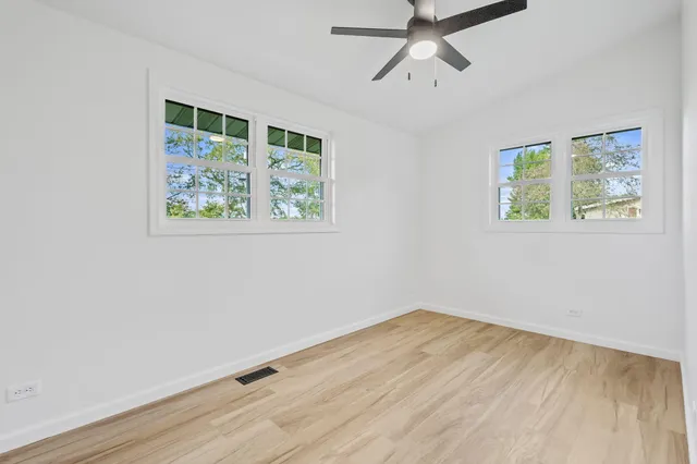 a view of room with wooden floor and window