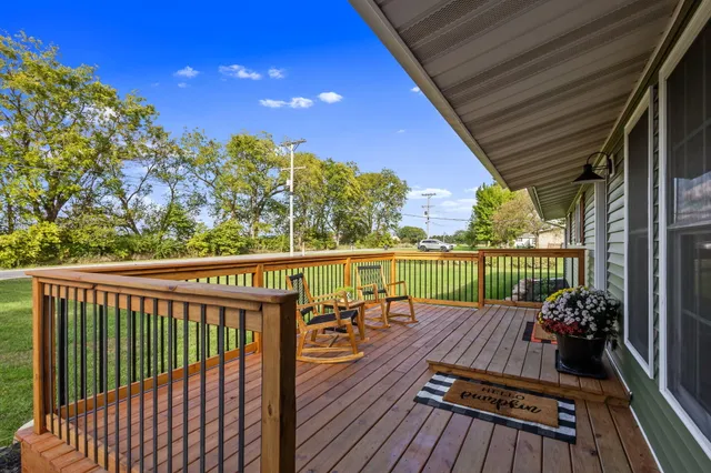 a view of balcony with couch and wooden floor