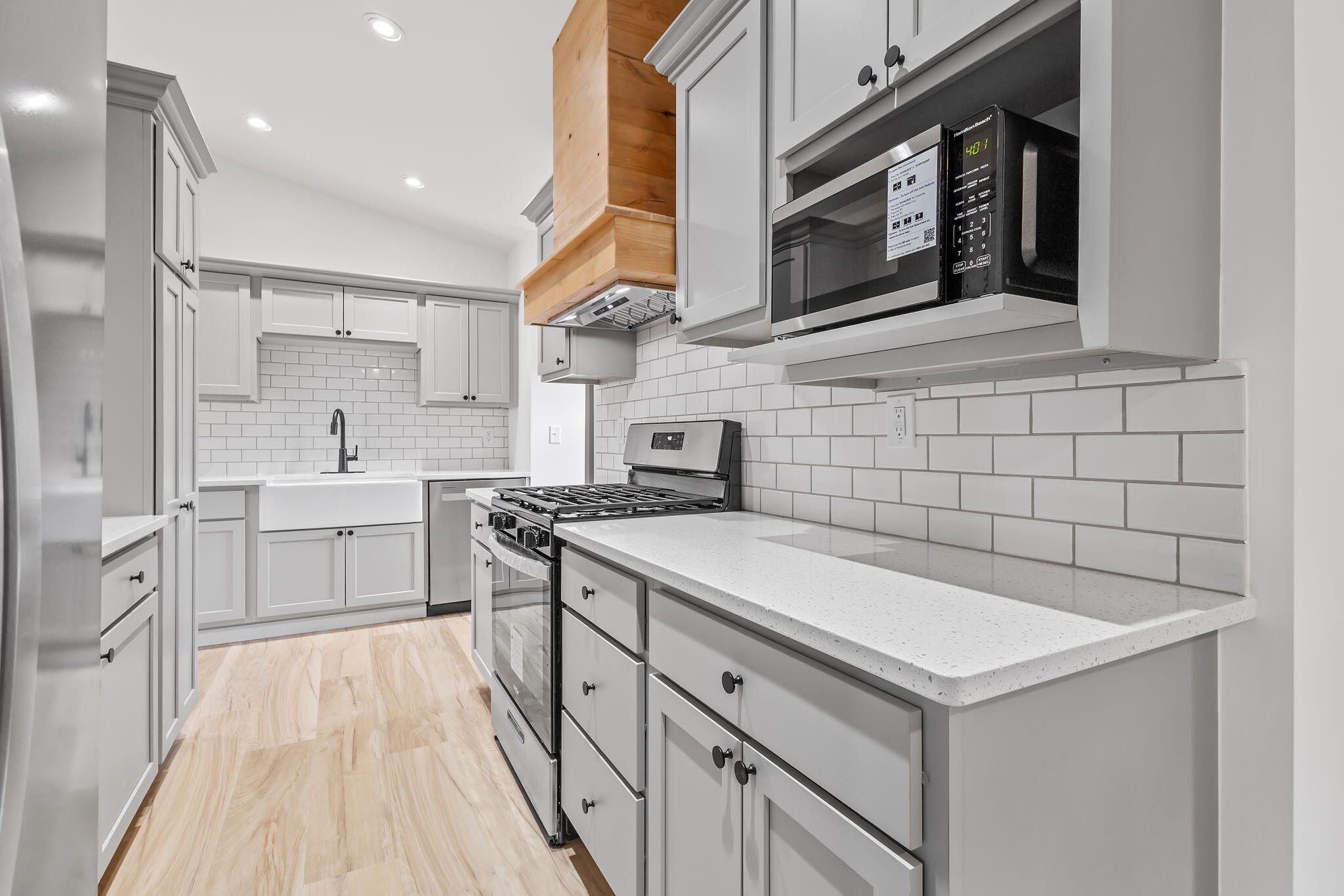 229 West Wood Road Rensselaer, IN 47978 - Photo 9 of 23 a kitchen with a sink stove and cabinets