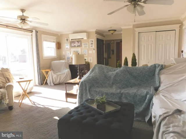 a living room with furniture and a window