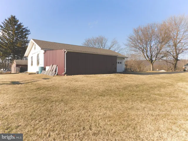 a view of a house with a snow on the yard