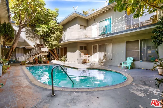 a view of a house with pool porch and sitting area