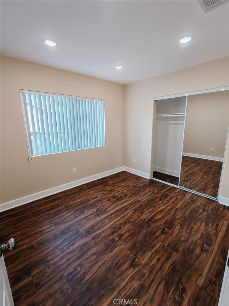 2523 Maynard Drive Duarte, CA 91010 - Photo 32 of 61 a view of an empty room with wooden floor and a window