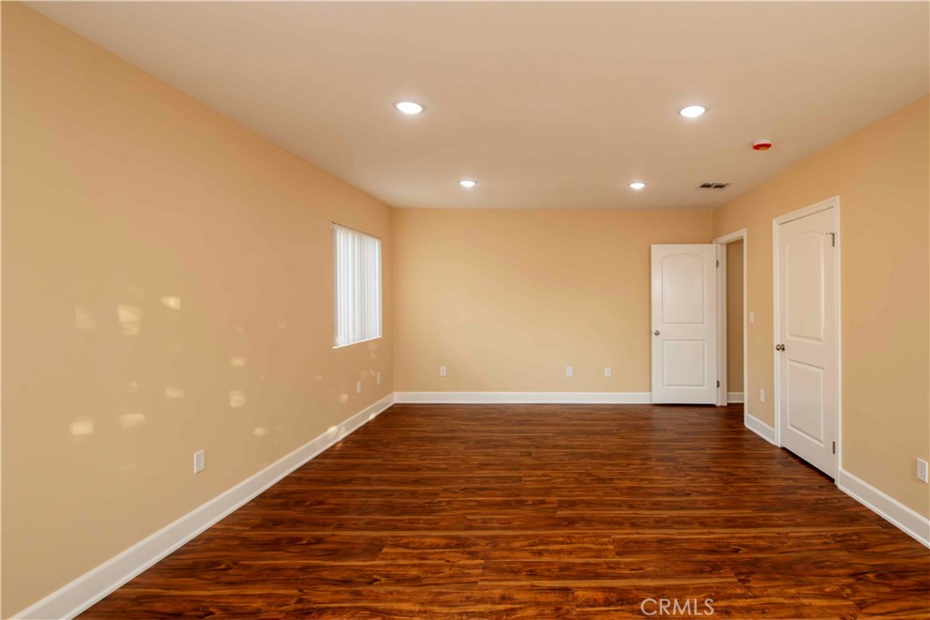 2523 Maynard Drive Duarte, CA 91010 - Photo 42 of 61 a view of an empty room with wooden floor and a window