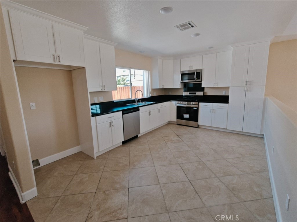 2523 Maynard Drive Duarte, CA 91010 - Photo 51 of 61 a large kitchen with stainless steel appliances granite countertop a refrigerator and a stove top oven