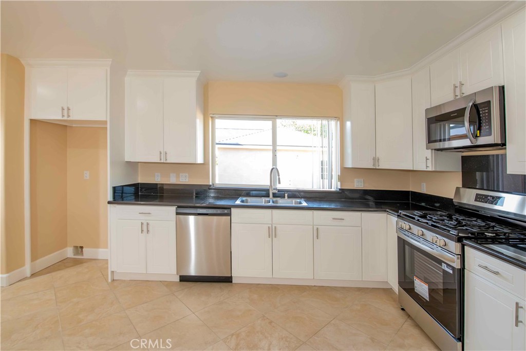 2523 Maynard Drive Duarte, CA 91010 - Photo 52 of 61 a kitchen with stainless steel appliances granite countertop a stove a sink and a microwave