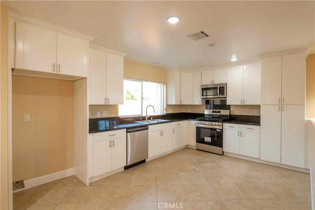 2523 Maynard Drive Duarte, CA 91010 - Photo 54 of 61 a large kitchen with granite countertop a sink and cabinets