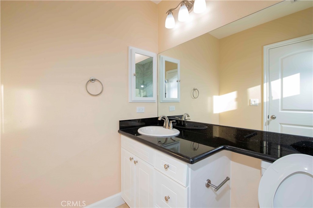 2523 Maynard Drive Duarte, CA 91010 - Photo 61 of 61 a bathroom with a granite countertop sink and a mirror
