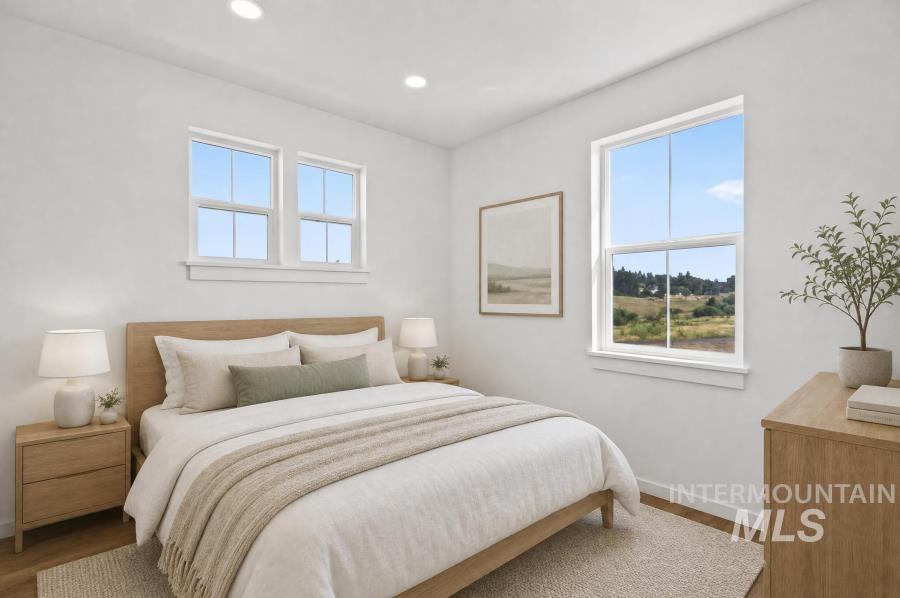 1298 Edington Moscow, ID 83843 - Photo 14 of 32 Recessed ceiling lighting, two double-hung windows, and wood-finish flooring